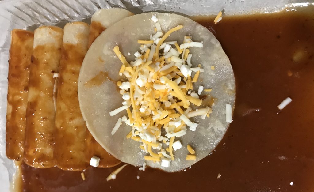 Corn tortillas with cheese in pan